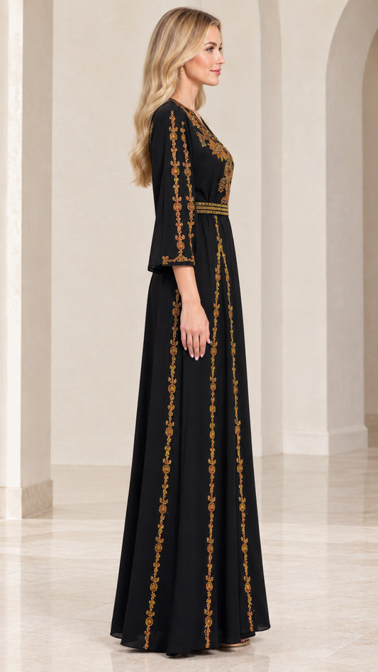 Side profile of woman wearing black embroidered maxi dress