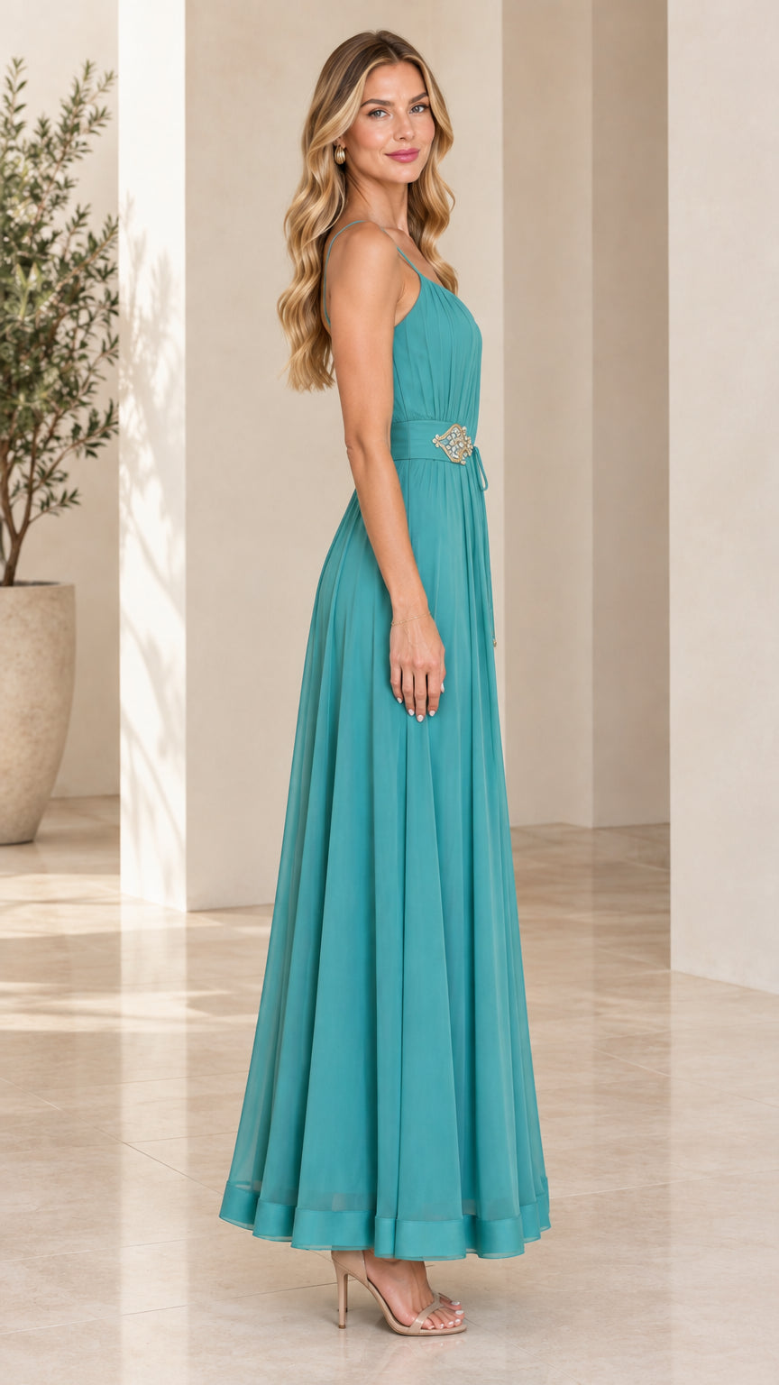 Side profile view of teal pleated chiffon formal evening maxi gown