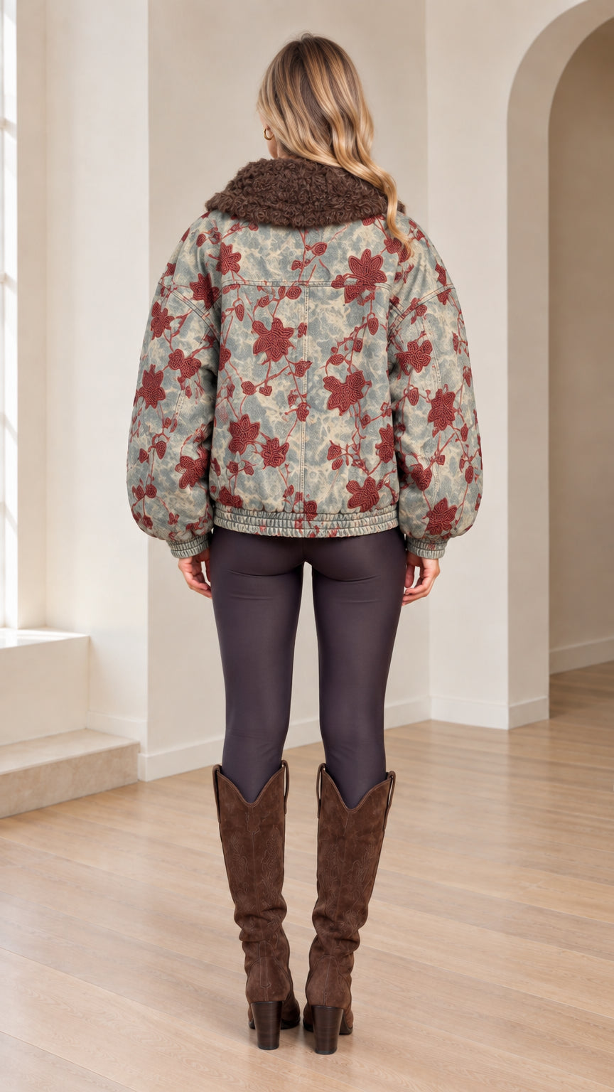 Back view of woman wearing Washed Blue floral embroidered bomber jacket
