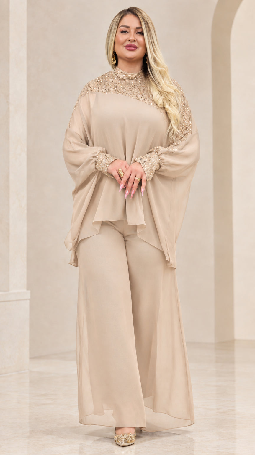 Front view of woman wearing Champagne beige chiffon cape top and wide-leg pant set