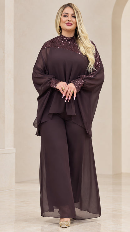 Front view of woman wearing Plum chiffon cape top and wide-leg pant set with sequin mock neck