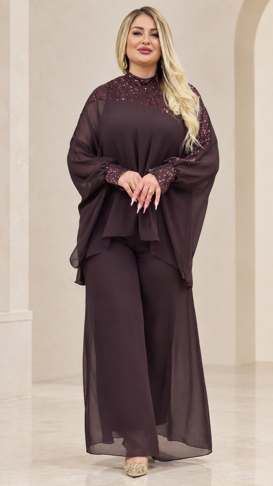 Front view of woman wearing Plum chiffon cape top and wide-leg pant set with sequin mock neck