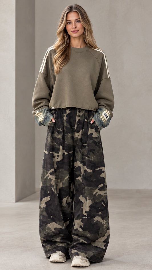 Front full-length view of woman wearing olive green cropped sweatshirt and camouflage wide-leg pants set