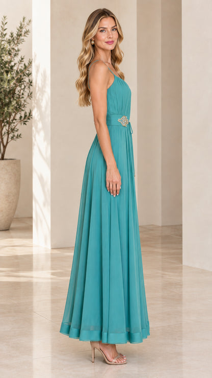 Side profile view of teal pleated chiffon formal evening maxi gown