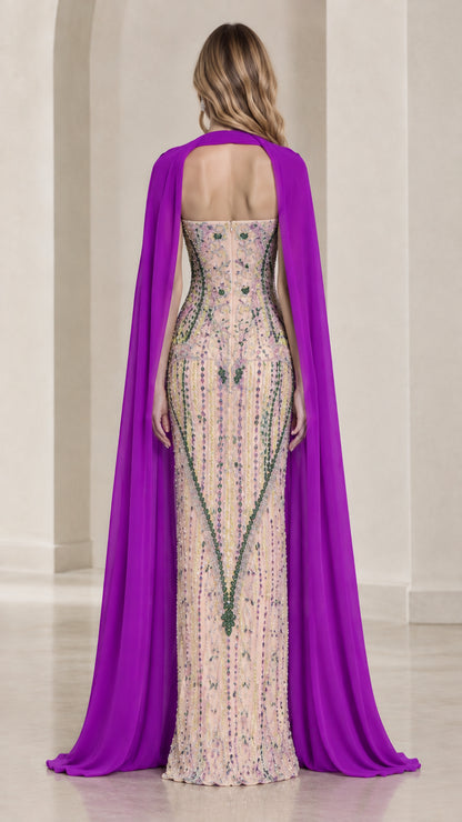 Rear view displaying flowing purple chiffon cape over beaded strapless floor-length gown