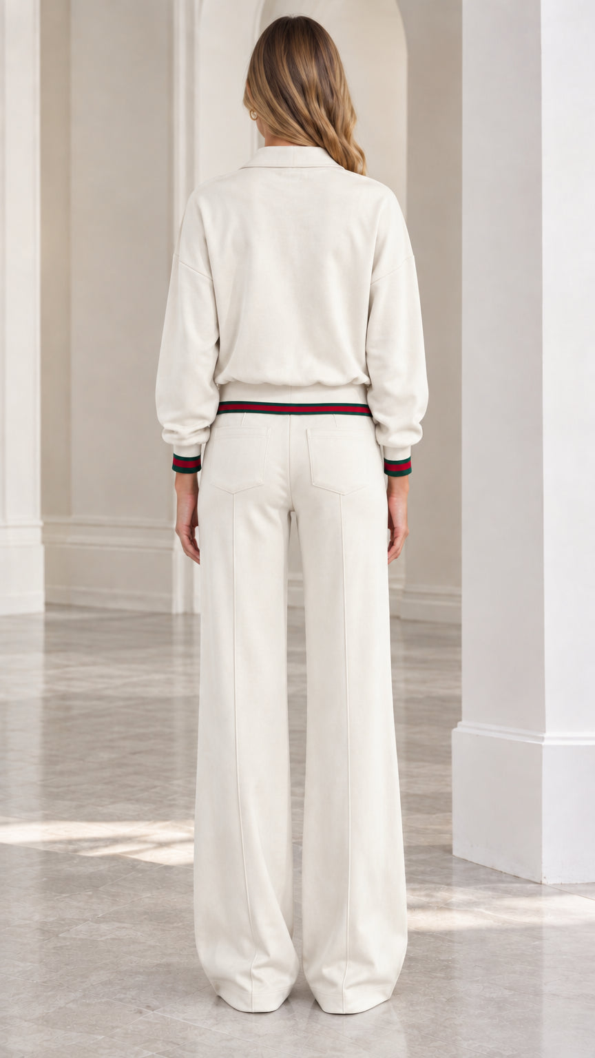 Back view of women's cream zip jacket and wide-leg trousers