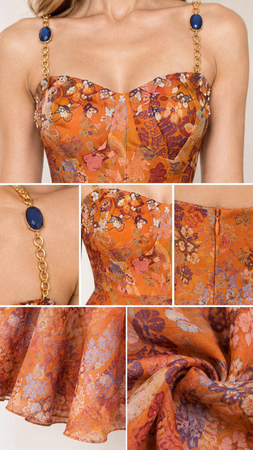 Close-up details of sweetheart bodice, jewel chain straps, and back zipper