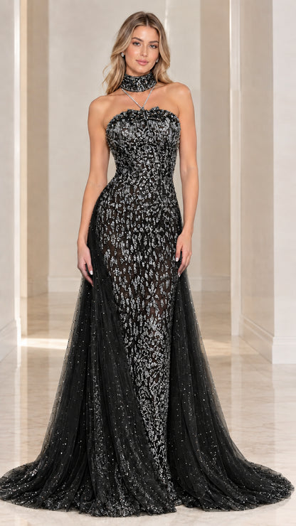 Model wearing Black embellished lace strapless evening gown with matching choker and train