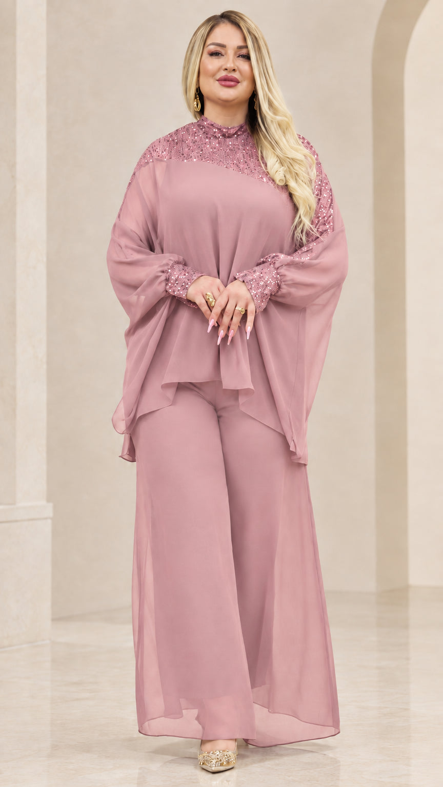 Front view of woman wearing Dusty Pink chiffon cape top and wide-leg pant set with sequin neckline