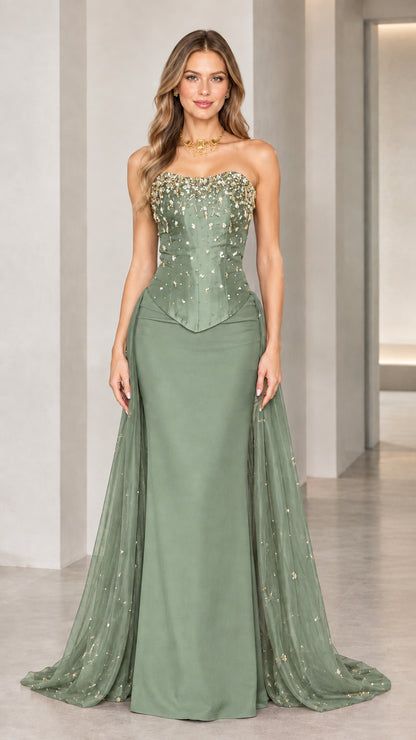 Model wearing sage green strapless beaded corset gown with sweeping train