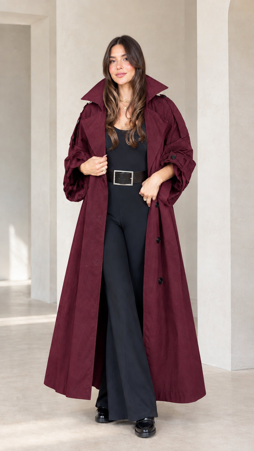 Front view of woman wearing burgundy wine red maxi trench coat