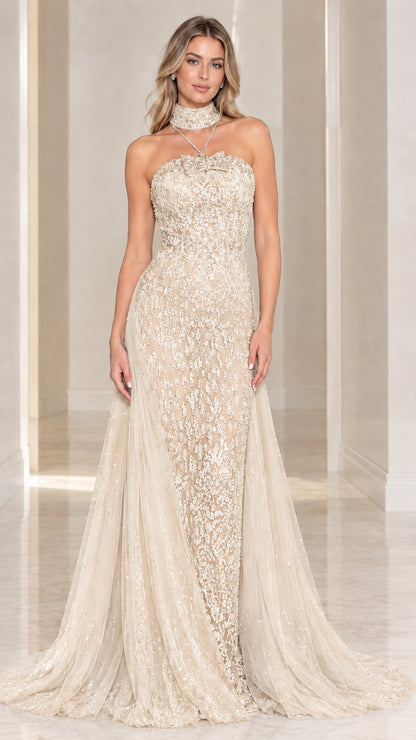 Model wearing Champagne gold lace strapless formal gown with sweeping train